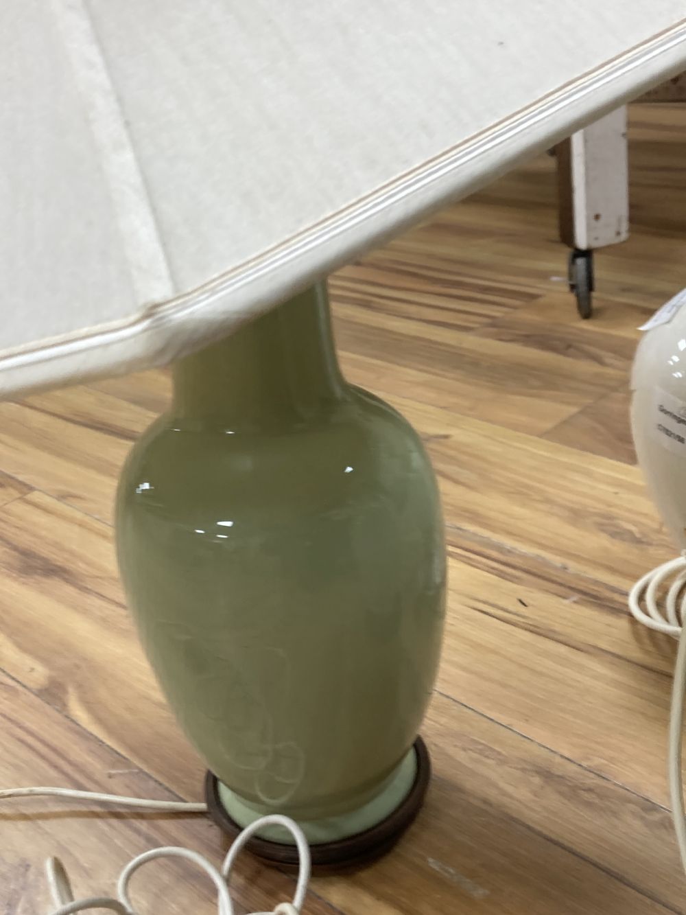A pair lime-green glazed table lamps, 38cm, one with shade and one other earthenware lamp